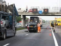 auto valt van oplegger vrachtwagen A15