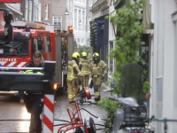 Brand in spouwmuur in woning binnenstad Voorstraat Dordrecht