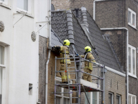 Brand in spouwmuur in woning binnenstad Voorstraat Dordrecht