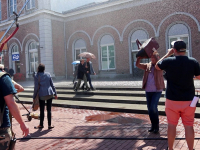 Lokale regenbui voor reclamespot Station Dordrecht