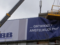 Meters groot spandoek met : Refaja overgedragen aan ABB Bouwgroep